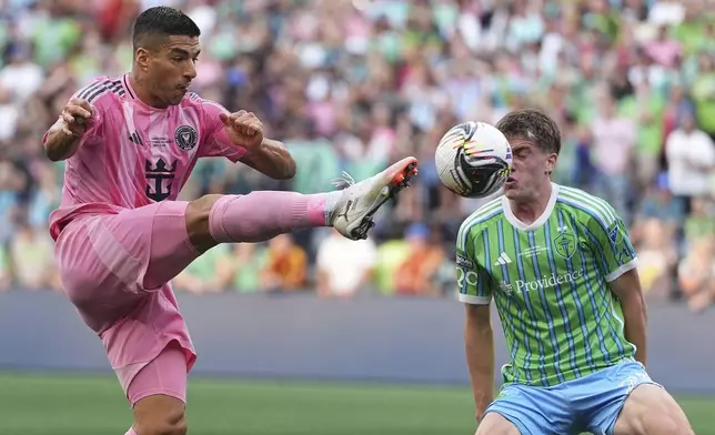 Inter Miami forward Luis Suárez, left, can't tip the ball past Seattle Sounders midfielder Reed Baker-Whiting, right, near the goal during the first half of a Leagues Cup final soccer match Sunday, Aug. 31, 2025, in Seattle. (AP Photo/Lindsey Wasson)