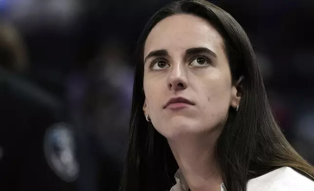 Indiana Fever's Caitlin Clark sits on the bench before a WNBA basketball game against the Golden State Valkyries, Sunday, Aug. 31, 2025, in San Francisco. (AP Photo/Godofredo A. Vásquez)