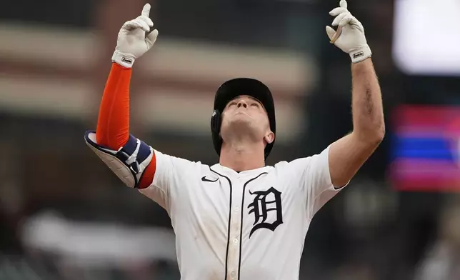 Detroit Tigers designated hitter Kerry Carpenter celebrates after hitting a single during the ninth inning of a baseball game against the Atlanta Braves, Sunday, Sept. 21, 2025, in Detroit. (AP Photo/Ryan Sun)