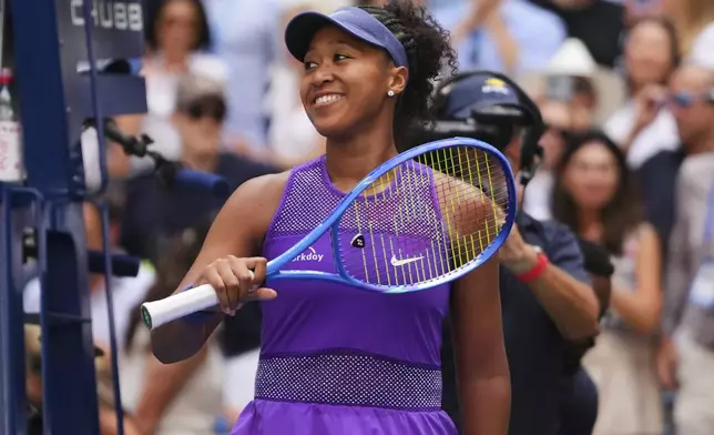 Naomi Osaka, of Japan, celebrates after winning a match against Coco Gauff, of the United States, during the fourth round of the US Open tennis championships, Monday, Sept. 1, 2025, in New York. (AP Photo/Kirsty Wigglesworth)