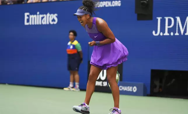 Naomi Osaka, of Japan, reacts during a match against Coco Gauff, of the United States, in the fourth round of the US Open tennis championships, Monday, Sept. 1, 2025, in New York. (AP Photo/Kirsty Wigglesworth)