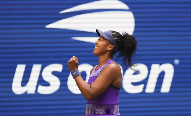 Naomi Osaka, of Japan, celebrates after winning a match against Coco Gauff, of the United States, during the fourth round of the US Open tennis championships, Monday, Sept. 1, 2025, in New York. (AP Photo/Kirsty Wigglesworth)