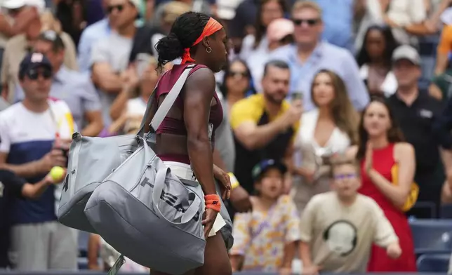 Coco Gauff, of the United States, leaves the court after losing a match against Naomi Osaka, of Japan, during the fourth round of the US Open tennis championships, Monday, Sept. 1, 2025, in New York. (AP Photo/Kirsty Wigglesworth)