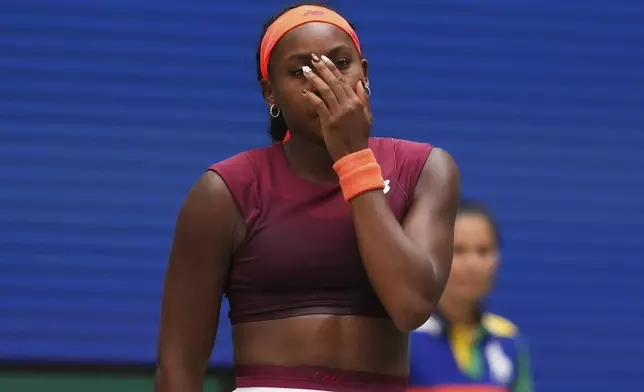 Coco Gauff, of the United States, reacts during a match against Naomi Osaka, of Japan, in the fourth round of the US Open tennis championships, Monday, Sept. 1, 2025, in New York. (AP Photo/Kirsty Wigglesworth)
