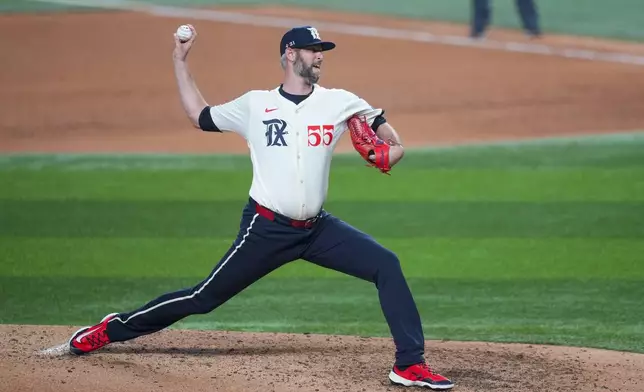 Texas Rangers pitcher Chris Martin throws to the Miami Marlins during the sixth inning of a baseball game Friday, Sept. 19, 2025, in Arlington, Texas. (AP Photo/Julio Cortez)