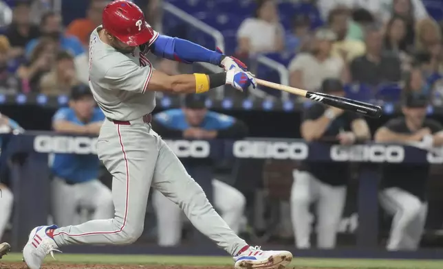 Philadelphia Phillies' Trea Turner hits a home run during the sixth inning of a baseball game against the Miami Marlins Sunday, Sept. 7, 2025, in Miami. (AP Photo/Marta Lavandier)