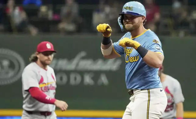 Milwaukee Brewers' Jake Bauers reacts after hitting an RBI double during the fourth inning of a baseball game against the St. Louis Cardinals Friday, Sept. 12, 2025, in Milwaukee. (AP Photo/Morry Gash)