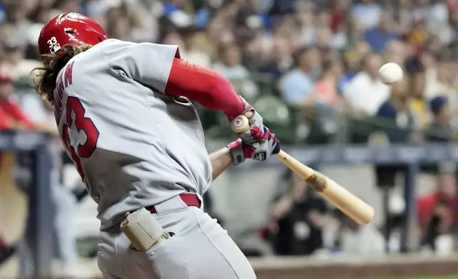 St. Louis Cardinals' Brendon Donovan hits a single during the seventh inning of a baseball game against the Milwaukee Brewers Friday, Sept. 12, 2025, in Milwaukee. (AP Photo/Morry Gash)
