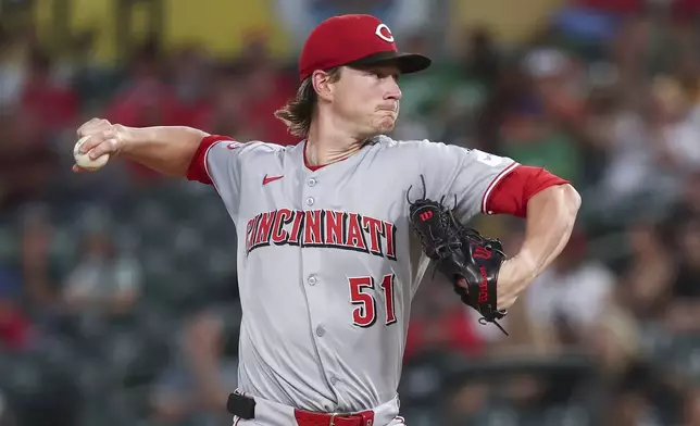 Cincinnati Reds pitcher Brady Singer throws to the Athletics during the first inning of a baseball game Friday, Sept. 12, 2025, in West Sacramento, Calif. (AP Photo/Sara Nevis)