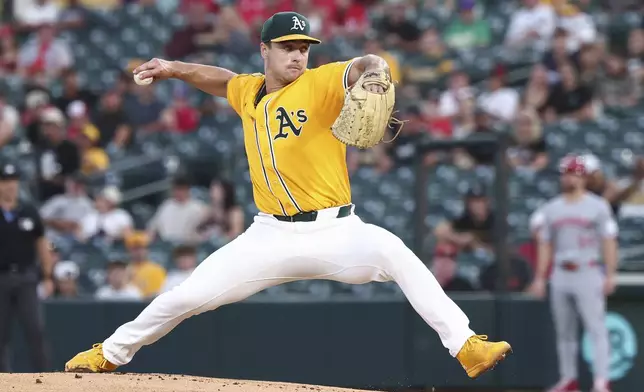 Athletics pitcher J.T. Ginn throws to the Cincinnati Reds during the first inning of a baseball game Friday, Sept. 12, 2025, in West Sacramento, Calif. (AP Photo/Sara Nevis)