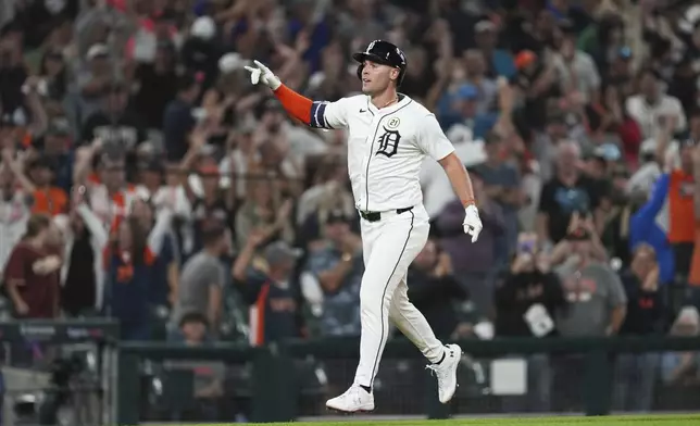 Detroit Tigers' Kerry Carpenter celebrates his home run against the Cleveland Guardians during the ninth inning of a baseball game Tuesday, Sept. 16, 2025, in Detroit. (AP Photo/Paul Sancya)