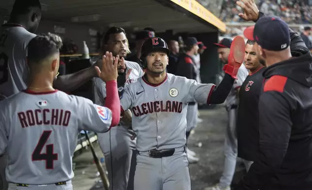 Cleveland Guardians' Steven Kwan celebrates scoring against the Detroit Tigersduring the10th inning of a baseball game Tuesday, Sept. 16, 2025, in Detroit. (AP Photo/Paul Sancya)