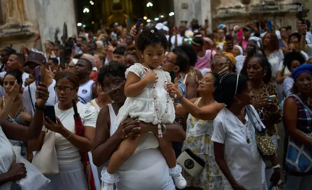 Faithful gather for a procession honoring Our Lady of Mercy in Havana, Wednesday, Sept. 24, 2025. (AP Photo/Ramon Espinosa)
