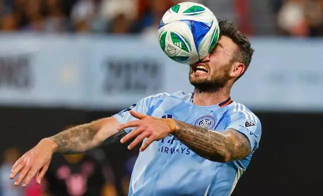 New York City FC midfielder Aiden O'Neill (21) heads the ball during the first half of a MLS soccer game against Inter Miami, Wednesday, Sept. 24, 2025, in New York. (AP Photo/Noah K. Murray)