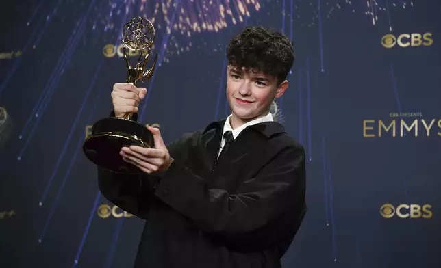 Owen Cooper, winner of the award for outstanding supporting actor in a limited or anthology series or movie for "Adolescence," poses in the press room during the 77th Primetime Emmy Awards on Sunday, Sept. 14, 2025, at the Peacock Theater in Los Angeles. (Photo by Richard Shotwell/Invision/AP)