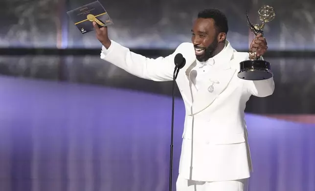 Tramell Tillman accepts the award for outstanding supporting actor in a drama series for "Severance" during the 77th Primetime Emmy Awards on Sunday, Sept. 14, 2025, at the Peacock Theater in Los Angeles. (AP Photo/Chris Pizzello)