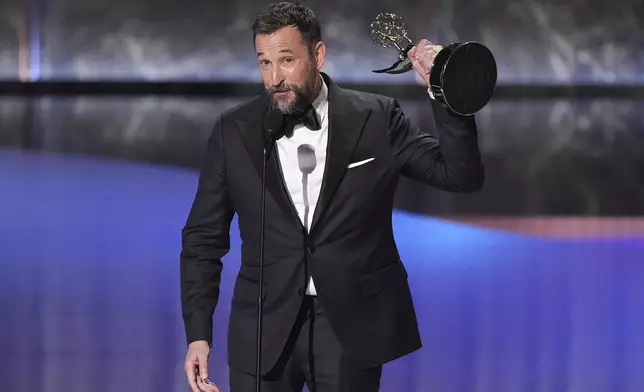 Noah Wyle accepts the award for outstanding lead actor in a drama series for "The Pitt" during the 77th Primetime Emmy Awards on Sunday, Sept. 14, 2025, at the Peacock Theater in Los Angeles. (AP Photo/Chris Pizzello)
