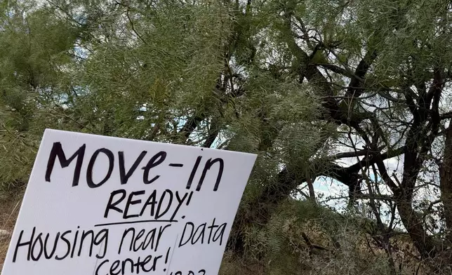 A sign advertises housing for workers along the road to the Stargate artificial intelligence data center complex on Monday, Sept. 22, 2025. (AP Photo/Matt O'Brien)