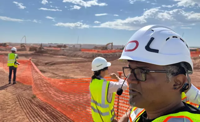 Mahesh Thiagarajan, executive vice president of Oracle Cloud Infrastructure, shows media the Stargate artificial intelligence data center project in Abilene, Texas on Tuesday Sept. 23, 2025. (AP Photo/Matt O’Brien)