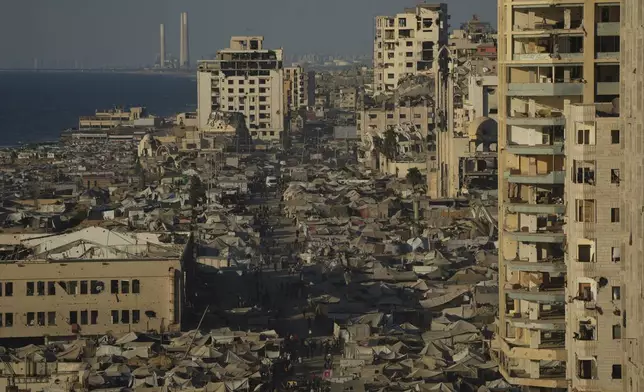 A makeshift tent camp for displaced Palestinians stretches across an area near the Gaza City port, Monday, Sept. 1, 2025. (AP Photo/Jehad Alshrafi)
