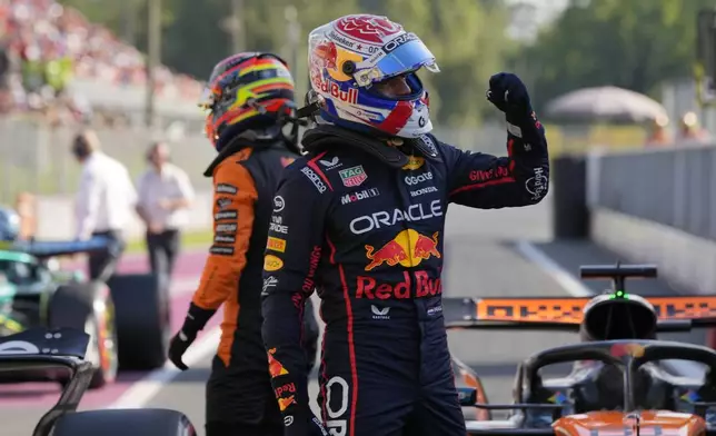 Red Bull driver Max Verstappen of the Netherlands celebrates his pole position after the qualifying session ahead of the Italian Grand Prix at the Monza racetrack in Monza, Italy, Saturday, Sept. 6, 2025. (AP Photo/Luca Bruno)