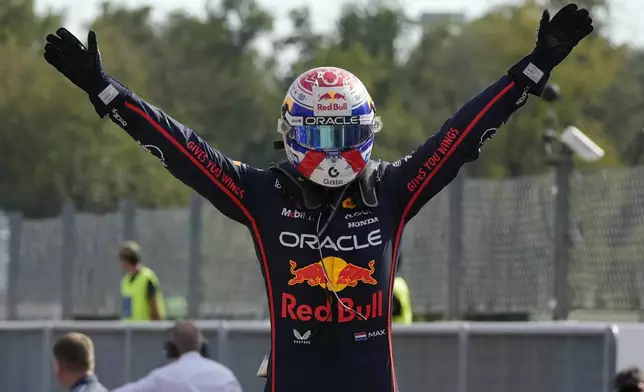 Red Bull driver Max Verstappen of the Netherlands celebrates after winning the Italian Grand Prix race at the Monza racetrack in Monza, Italy, Sunday, Sept. 7, 2025. (AP Photo/Luca Bruno)