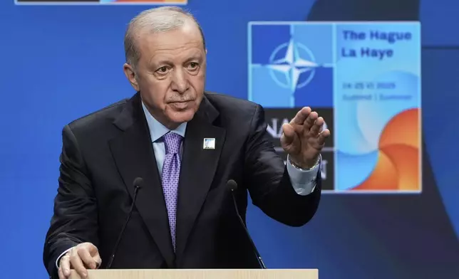 FILE - Turkish President Recep Tayyip Erdogan gestures during a press conference after the plenary session at the NATO summit in The Hague, Netherlands, on June 25, 2025. (AP Photo/Markus Schreiber, File)