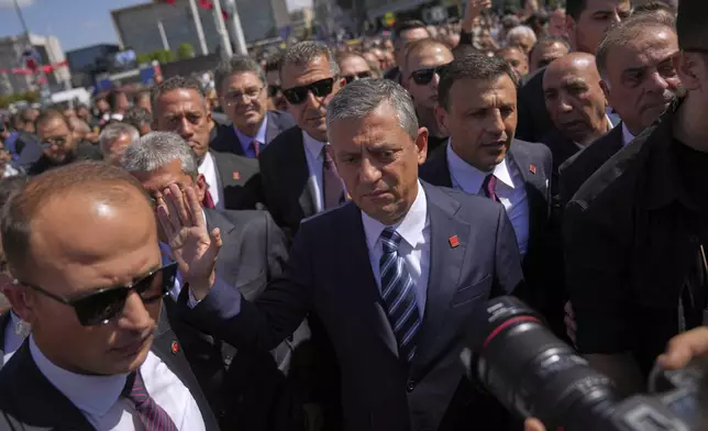 Republican People's Party or (CHP) leader Ozgur Ozel, center, arrives to a ceremony to commemorate the 102nd anniversary of the foundation of the party at Taksim square, Istanbul, Turkey, Tuesday, Sept. 9, 2025. (AP Photo/Francisco Seco)