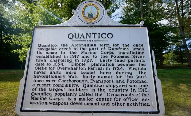 A historical marker is pictured at the entrance of Marine Base Quantico, Friday Sep. 26, 2025, in Quantico, Va. (AP Photo/Steve Helber)