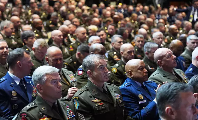 U.S. military senior leadership are seen before President Donald Trump arrives to speaks at Marine Corps Base Quantico, Tuesday, Sept. 30, 2025 in Quantico, Va. (AP Photo/Evan Vucci)