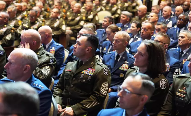 U.S. military senior leadership listen as President Donald Trump speaks at Marine Corps Base Quantico, Tuesday, Sept. 30, 2025 in Quantico, Va. (AP Photo/Evan Vucci)