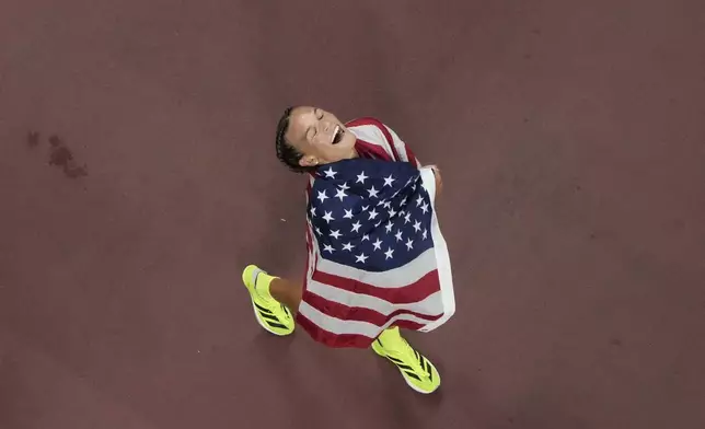 United States' Anna Hall celebrates after winning the heptathlon at the World Athletics Championships in Tokyo, Saturday, Sept. 20, 2025. (AP Photo/David J. Phillip)