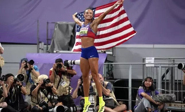 United States' Anna Hall celebrates after winning the gold medal in the heptathlon at the World Athletics Championships in Tokyo, Saturday, Sept. 20, 2025. (AP Photo/Matthias Schrader)