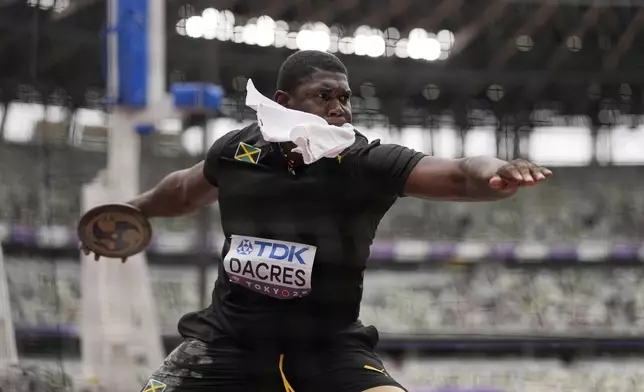 Jamaica's Fedrick Dacres makes an attempt in the men's discus throw qualification at the World Athletics Championships in Tokyo, Saturday, Sept. 20, 2025. (AP Photo/Matthias Schrader)