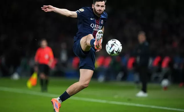 PSG's Khvicha Kvaratskhelia controls the ball during the French League One soccer match between Paris Saint-Germain and Auxerre at the Parc des Princes in Paris, Saturday, Sept. 27, 2025. (AP Photo/Thibault Camus)