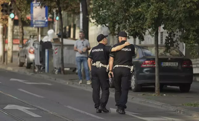 Serbian police officers guard street during the Gay Pride march in Belgrade, Serbia, Saturday, Sept. 6, 2025. (AP Photo/Darko Vojinovic)