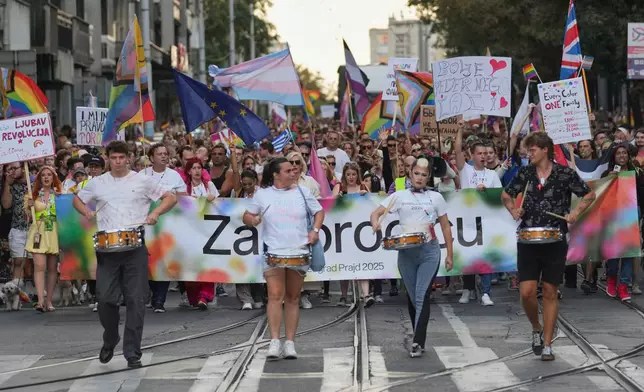 Participants take part in the Gay Pride march in Belgrade, Serbia, Saturday, Sept. 6, 2025. (AP Photo/Darko Vojinovic)
