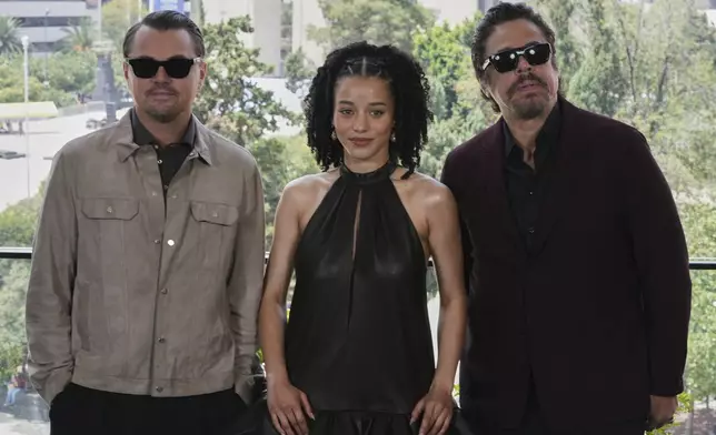 Leonardo DiCaprio, from left, Chase Infiniti and Benicio Del Toro pose during a photo call for the film 'One Battle After Another' in Mexico City, Thursday, Sept. 18, 2025. (AP Photo/Eduardo Verdugo)