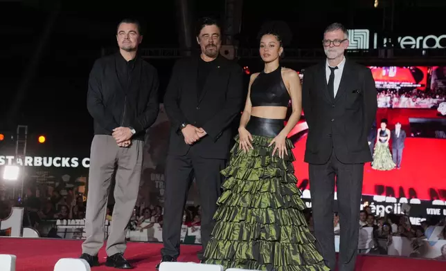 From left, actors Leonardo DiCaprio, Benicio Del Toro, Chase Infiniti and Paul Thomas Anderson pose for photos during a red carpet event for the film "One Battle After Another" in Mexico City, Thursday, Sept. 18, 2025. (AP Photo/Marco Ugarte)