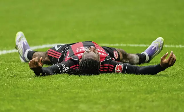 Frankfurt's Elye Wahi is on the ground during a German Bundesliga soccer match between Eintracht Frankfurt and Union Berlin in Frankfurt, Germany, Sunday, Sept. 21, 2025. (AP Photo/Michael Probst)