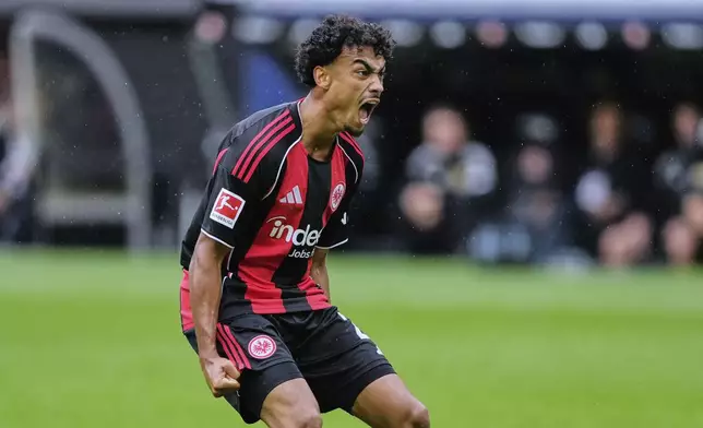 Frankfurt's Nathaniel Brown celebrates his side's first goal during a German Bundesliga soccer match between Eintracht Frankfurt and Union Berlin in Frankfurt, Germany, Sunday, Sept. 21, 2025. (AP Photo/Michael Probst)