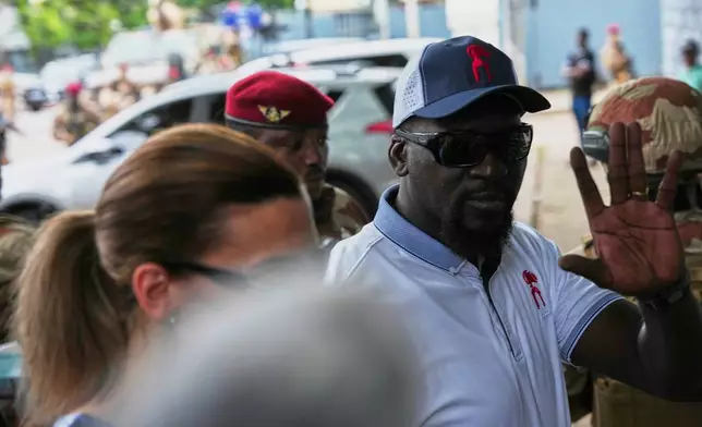 Guinea's interim President, Gen. Mamadi Doumbouya, arrives to cast his vote in the constitutional referendum in Conakry, Guinea, Sunday, Sept. 21, 2025. (AP Photo/Misper Apawu)