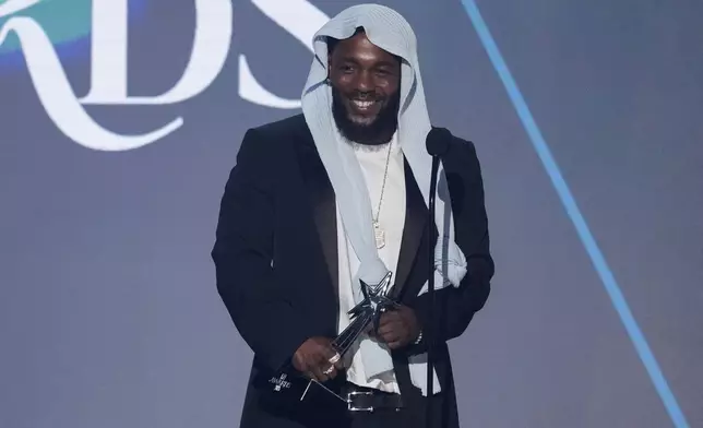 FILE - Kendrick Lamar accepts the award for album of the year for "GNX" during the BET Awards on June 9, 2025, at the Peacock Theater in Los Angeles. (AP Photo/Chris Pizzello, File)