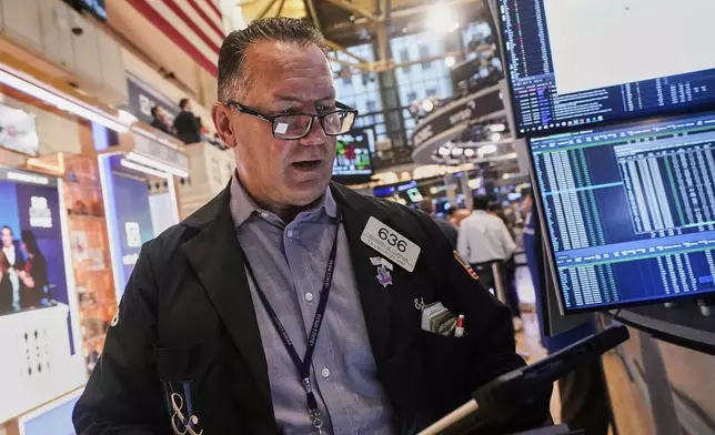 Trader Edward Curran works on the floor of the New York Stock Exchange, Monday, Sept. 15, 2025. (AP Photo/Richard Drew)