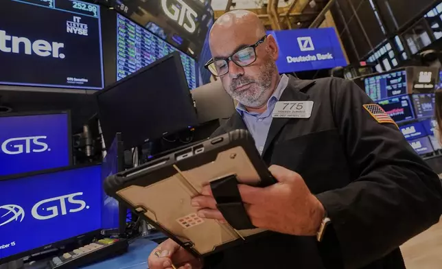 Trader Fred Demarco works on the floor of the New York Stock Exchange, Monday, Sept. 15, 2025. (AP Photo/Richard Drew)