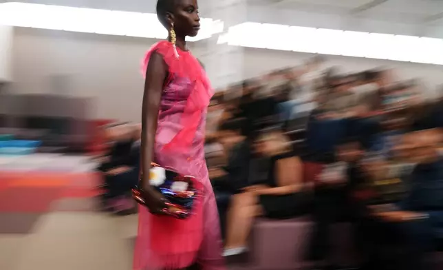 A model wears a creation as part of the Fendi Spring/Summer 2026 collection presented in Milan, Italy, Wednesday, Sept. 24, 2025. (AP Photo/Antonio Calanni)