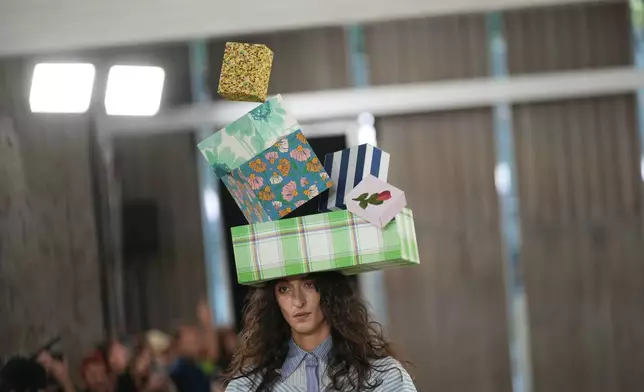 A model wears a creation part of the Moschino women's Spring-Summer 2026 collection, presented in Milan, Italy, Thursday, Sept. 25, 2025. (AP Photo/Antonio Calanni)