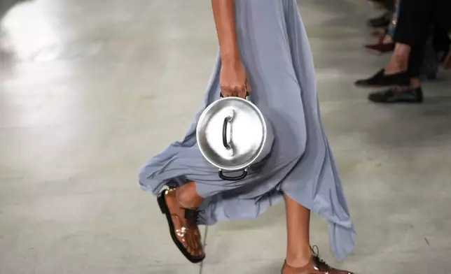 A model wears a creation part of the Moschino women's Spring-Summer 2026 collection, presented in Milan, Italy, Thursday, Sept. 25, 2025. (AP Photo/Antonio Calanni)