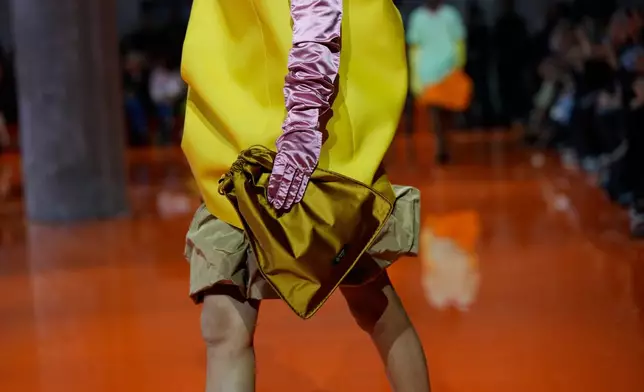 A model wears a creation as part of the Prada Spring/Summer 2026 collection presented in Milan, Italy, Thursday, Sept. 25, 2025. (AP Photo/Luca Bruno)