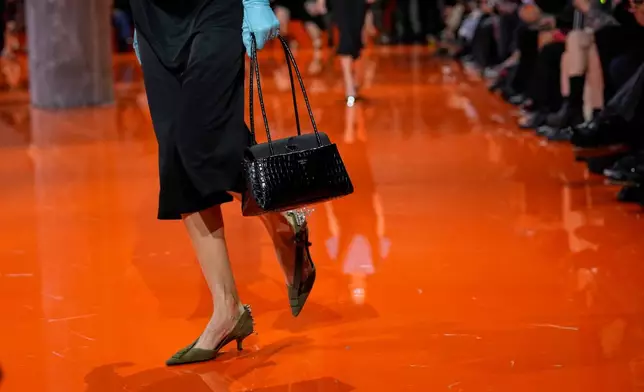 A model wears a creation as part of the Prada Spring/Summer 2026 collection presented in Milan, Italy, Thursday, Sept. 25, 2025. (AP Photo/Luca Bruno)